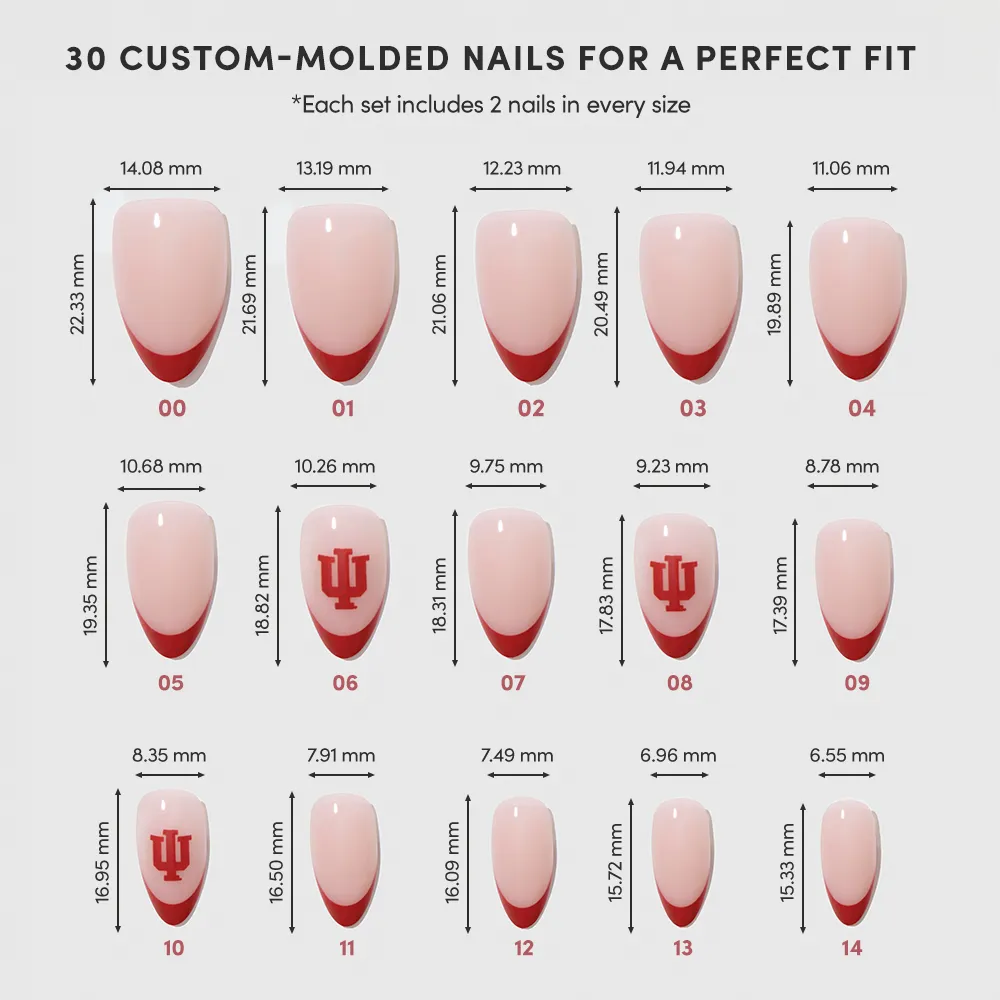 The Indiana Hoosiers Press-On Nail Set by glamnetic includes 15 custom-molded artificial nails in various sizes, with crimson French tips and team logo designs, displayed in three rows on a white background. - Product image