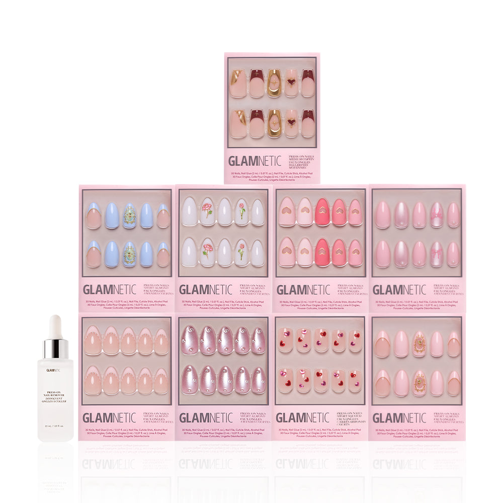 Ten boxes of glamnetic Love in 3D press-on nails, featuring pink and pastel almond-shaped sets with 3D pearl art, are stacked in a pyramid. A bottle of nail glue or serum is placed in front on the left side. - Product image