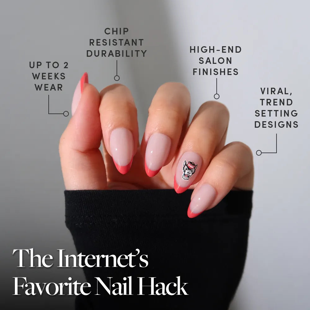 An NC State Wolfpack Press-On Nail Set by glamnetic features long, almond-shaped nails with pink tips, a floral accent, and red French tips. Enjoy long wear, chip resistance, salon finish, and trendy designs—the Internet’s Favorite Nail Hack. - Product image