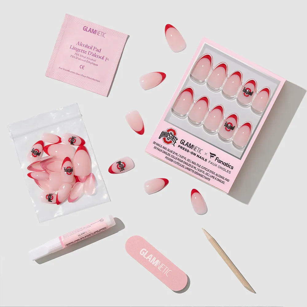 Show off your team spirit with the glamnetic Ohio State Buckeyes Press-On Nail Set, complete with nails, glue, alcohol pad, cuticle stick, nail file, and extra nails—all artfully displayed on a crisp white surface. - Product image