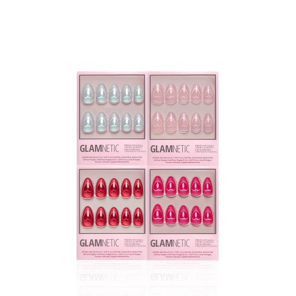 Four boxes of glamnetic Cupid's Magnetic Hearts press-on nails—featuring almond shapes in light blue, light pink, red, and bright pink—are arranged in a grid on a white background. Each box displays ten nails through a clear window. - Product image