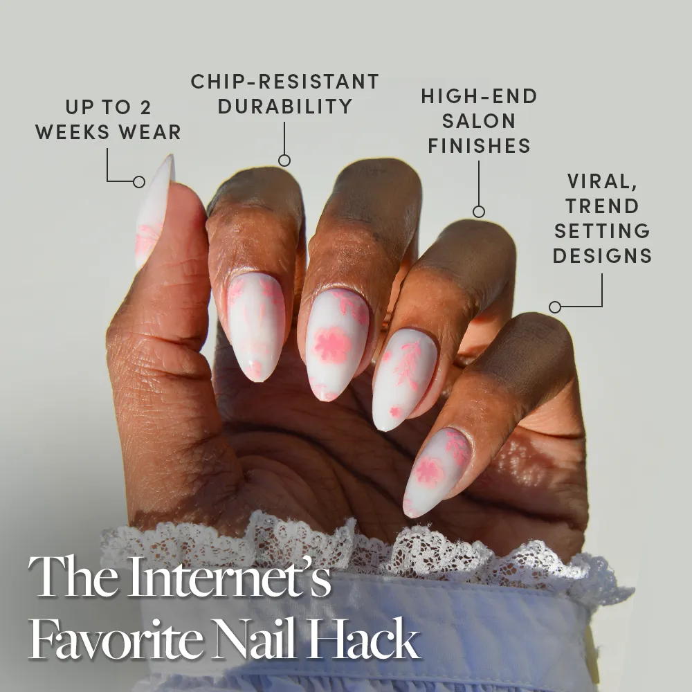 Showcasing glamnetic’s Fleur Amour: long, almond-shaped nails with pink and white floral design. Enjoy up to 2 weeks of chip-resistant wear, high-end finishes, and trendy looks. Discover why it’s the Internet’s Favorite Nail Hack!. - Product image