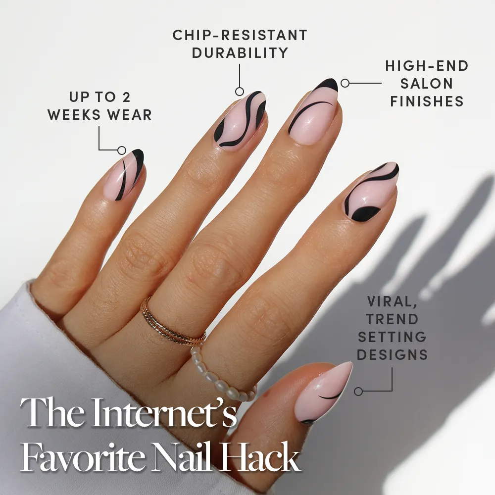 A hand with long, almond-shaped nails in glamnetic’s Ink Wave design—pink base and black abstract art. Boasts salon-quality finish, chip resistance, trendy style, durability, and up to 2 weeks of flawless wear. - Product image