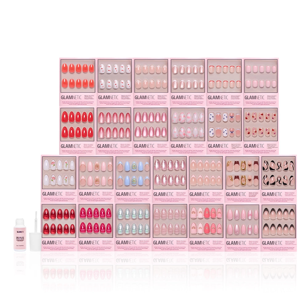 Several glamnetic Love Notes Collection press-on nail sets in almond and coffin styles are displayed in pink packaging, with a bottle of nail glue to the left on a white background. - Product image