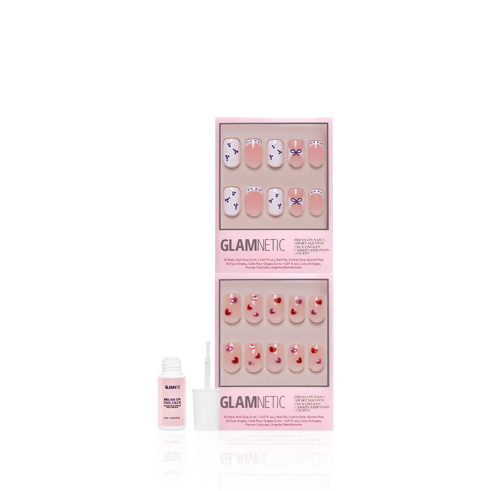 Two sets of glamnetic The Sweet Squovals pink press-on nails with heart designs in pink packaging, shown with a small open bottle of nail glue on a white background. Perfect as a cute squoval nail bundle. - Product image