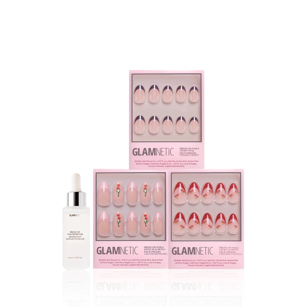 Four pink glamnetic press-on nail sets—including Cherry On Top, almond nails, and French tips—showcase floral and abstract designs, arranged in a row with a glamnetic Rose Oil Cuticle Pen on a white background. - Product image