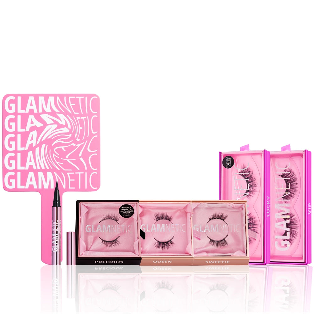 The glamnetic Flutter & Flirt Bundle includes a pink hand mirror, magnetic eyeliner, three pairs of lashes in a pink box, and two cat-eye half lash styles in purple boxes, all stylishly arranged. - Product image