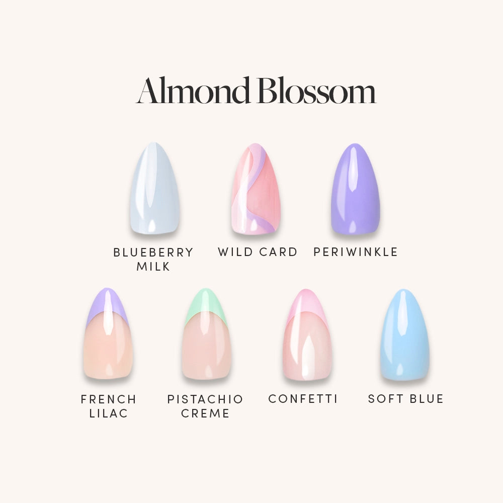 Six short almond nails from glamnetic’s Almond Blossom pastel set feature a glossy finish in Blueberry Milk, Wild Card (pink/white swirl), Periwinkle, French Lilac, Pistachio Creme, Confetti (pink/white), and Soft Blue. - Product image