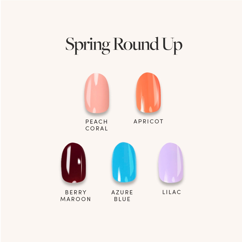 Five glossy nail polish shades—peach coral, apricot, berry maroon, azure blue, and lilac—are shown on short round nails for the glamnetic Spring Round Up collection on a light background with the product name above. - Product image