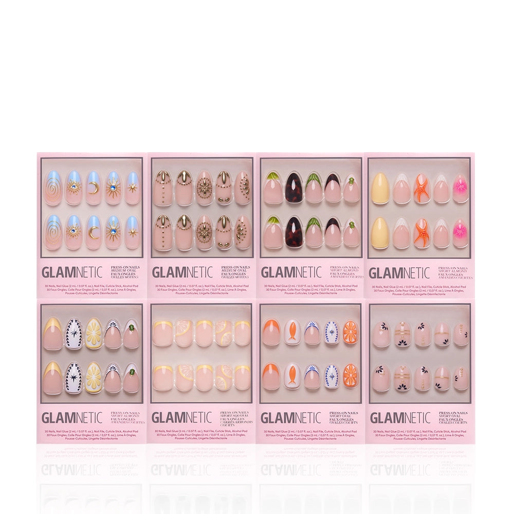 Eight sets of glamnetic 3D Souvenirs premium nail sets in pink boxes, with colorful swirls, sprinkles, hearts, fruit, and Euro Summer 3D designs, are neatly arranged in two rows on a white background for a salon-quality look. - Product image