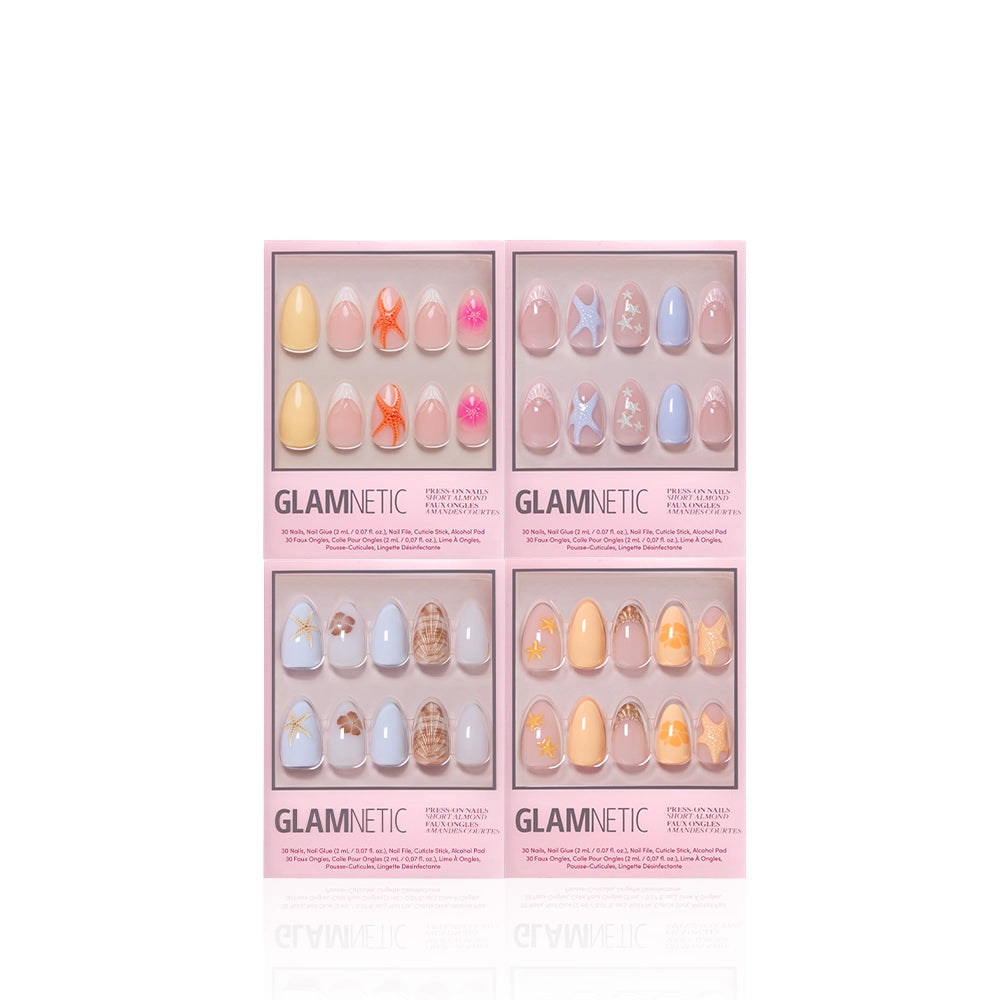 Four boxes of Glamnetic press-on nails—including butterfly, floral, geometric, and the Coastal Keepsakes set with seashell art—are displayed against a white background. - Product image
