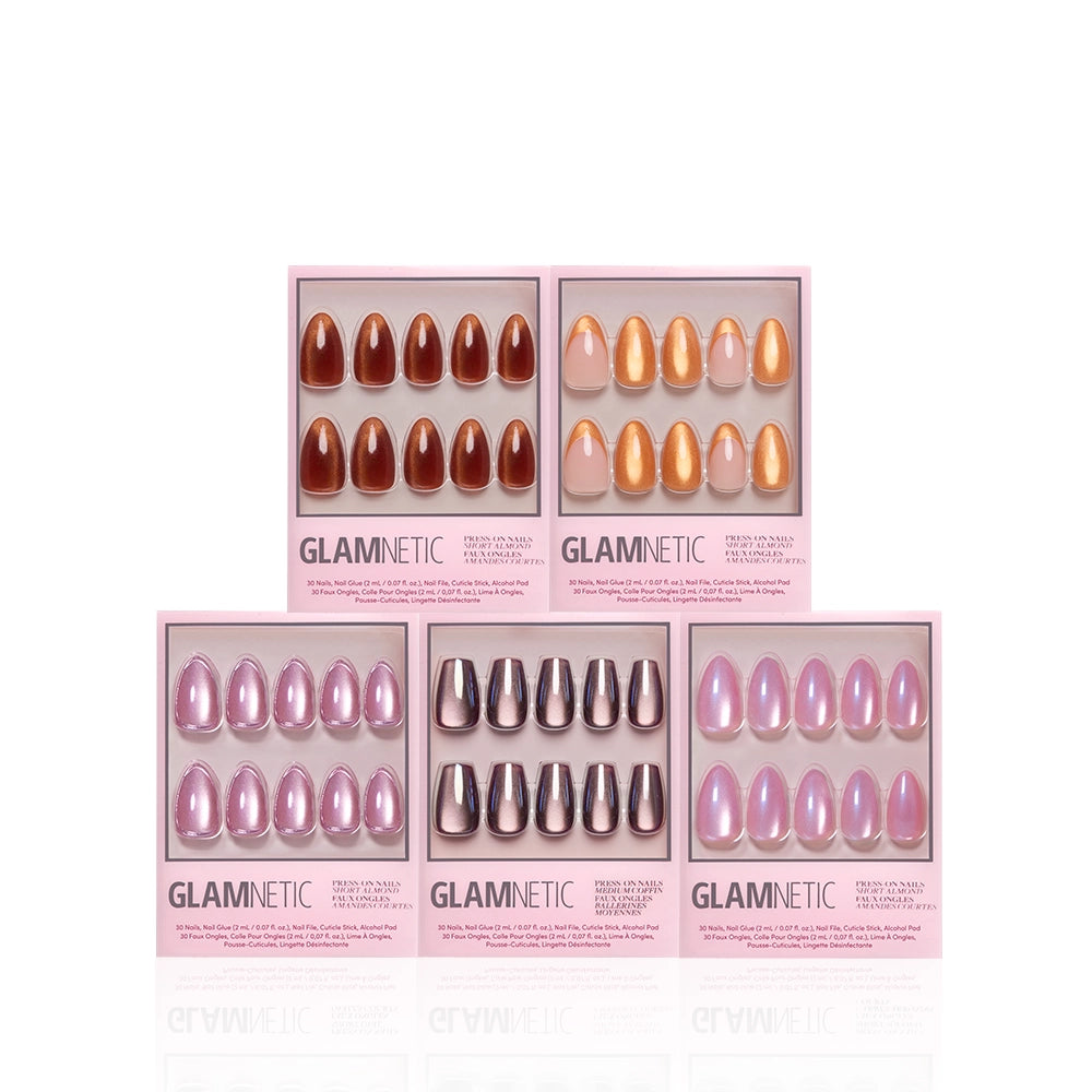 Five boxes of glamnetic Golden Hour press-on nails are arranged in two rows against a white background, showcasing salon-quality nails in various colors and finishes including glossy, metallic, velvet, and multi-dimensional shimmer designs. - Product image