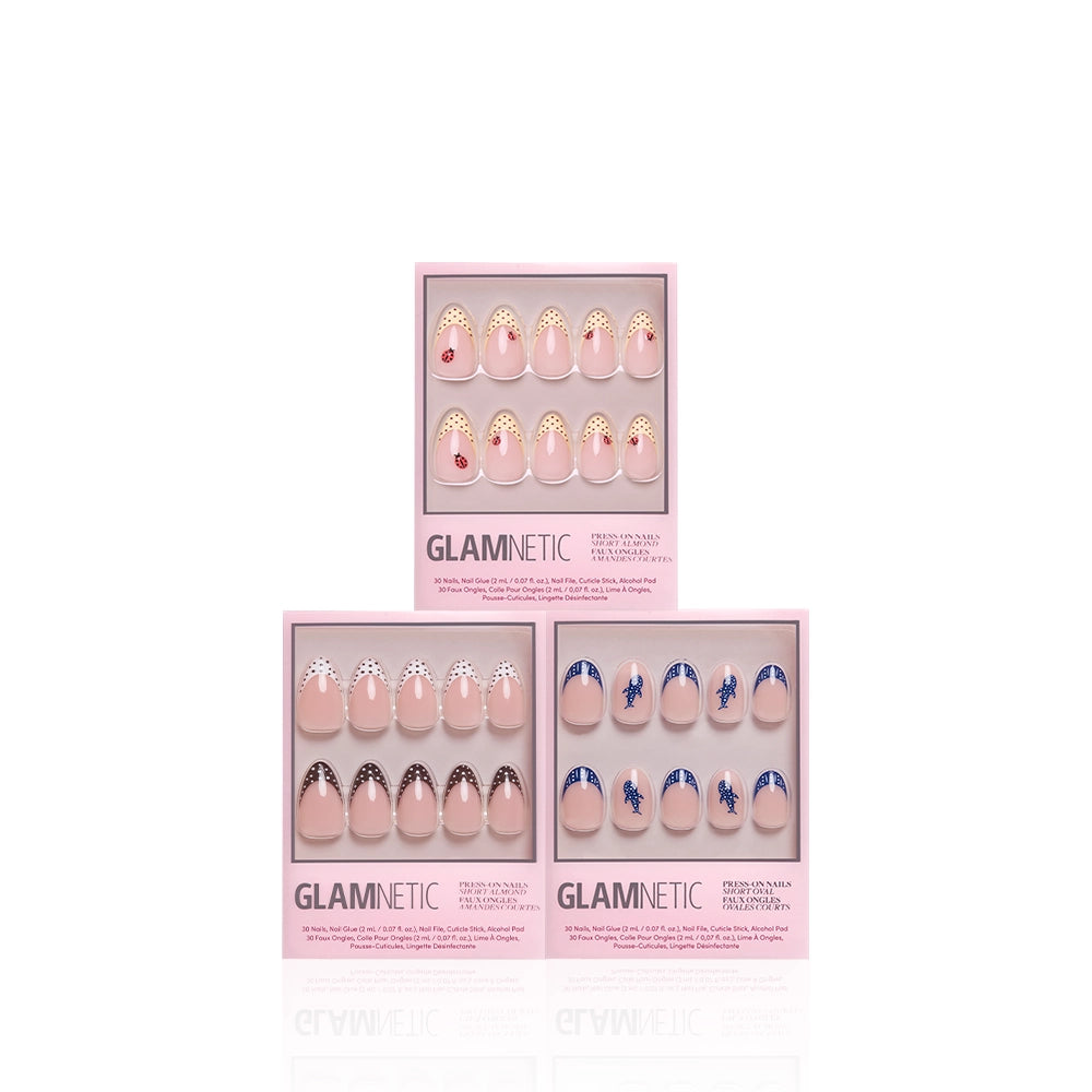 Three boxes of Glamnetic On The Dot press-on nails are showcased, including sets with gold and red gems, black and gold polka dots, plus blue waves over nude backgrounds in a trendy short almond shape. - Product image