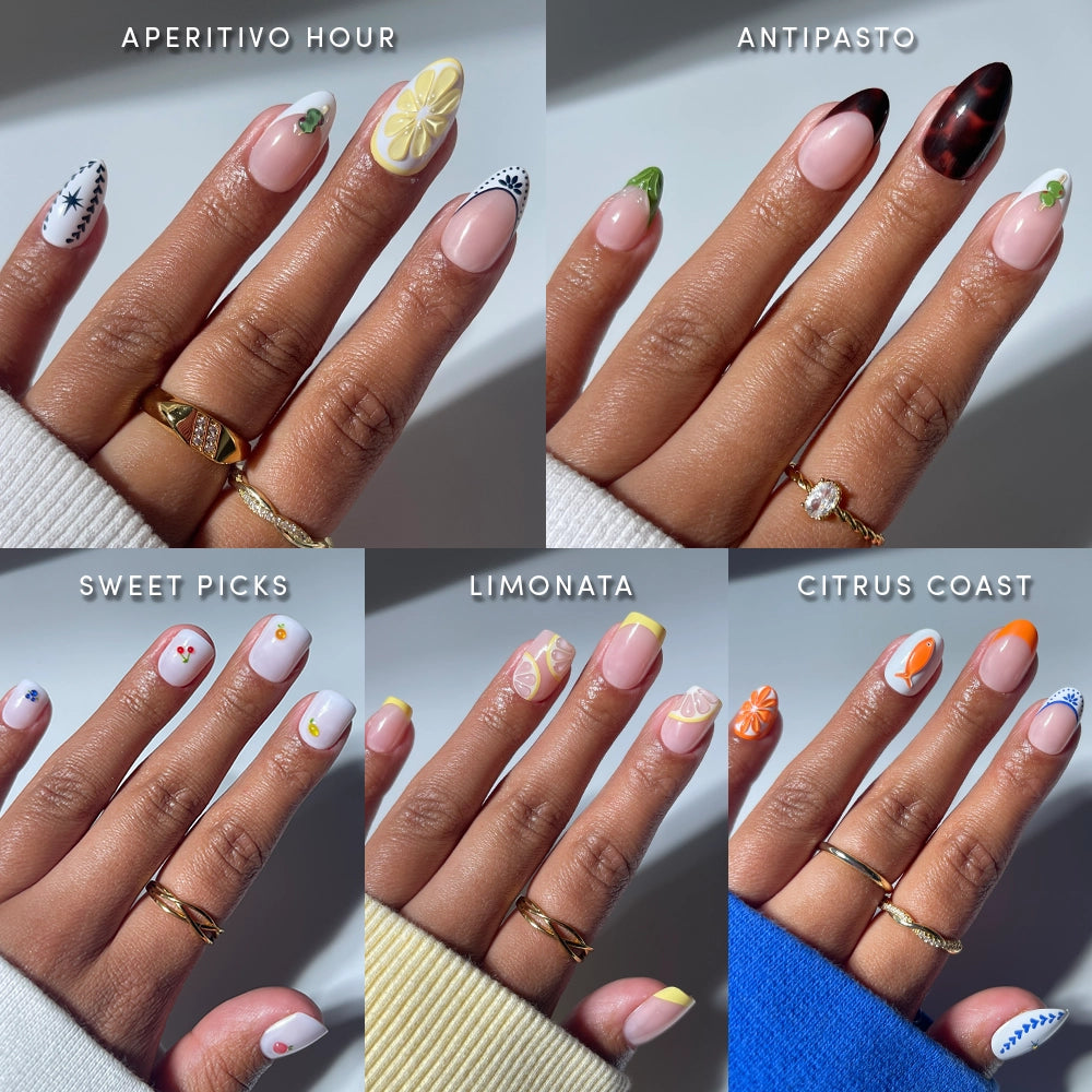 Six hands display glamnetic's Taste of Europe press-on nails, featuring Mediterranean-inspired designs like Aperitivo Hour and Citrus Coast, with bold patterns and playful 3D fruit accents—easy glam for any occasion.