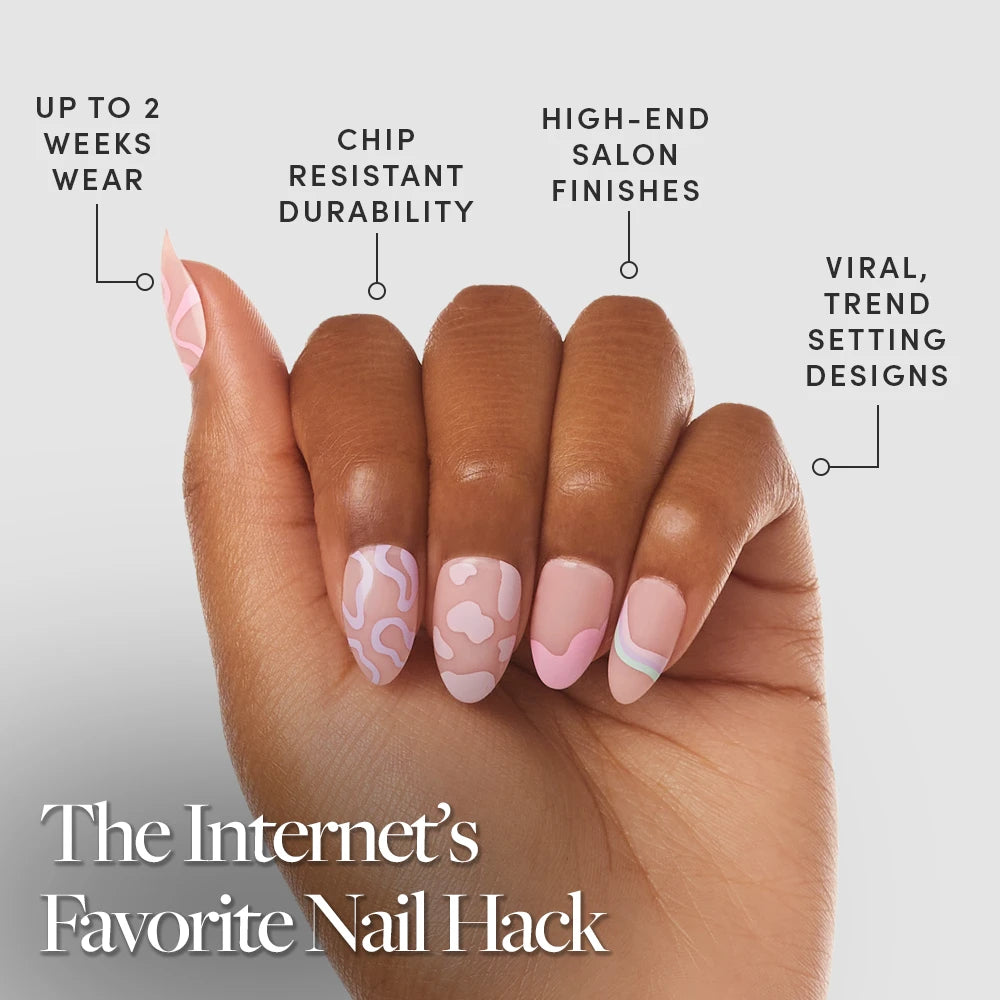 A hand with pink and pastel abstract semi-transparent Wild Card nails by glamnetic is shown, featuring up to 2 weeks' wear, chip-resistant durability, high-end salon finish, and viral trend-setting designs—The Internet’s Favorite Nail Hack. - Product image