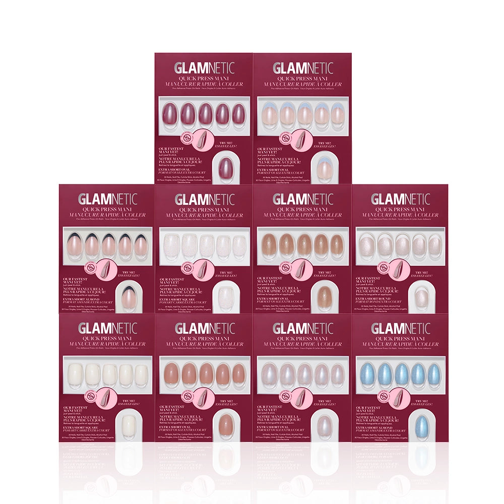 Ten boxes of glamnetic Les Petites Polishes in assorted colors and styles are stacked together. The burgundy boxes with clear windows display Quick Press Manis in nude, pink, white, and blue shades. - Product image