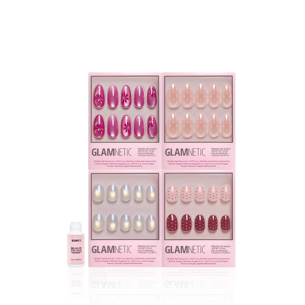 Four boxes of glamnetic's The Oval Moment press-on nails in pink, each with a glossy oval design—floral, ombré, pearl, and polka dot styles—paired with a nail glue bottle for spring-inspired manicures. - Product image