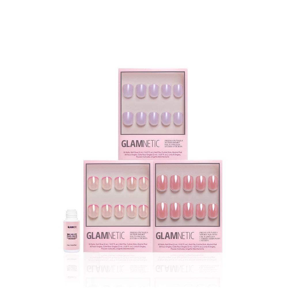 Three boxes of glamnetic’s The Short List press-on nails in pastel purple, light pink, and nude pink create the perfect natural spring look. Each set includes short squoval nails with nail glue, shown on a white background. - Product image