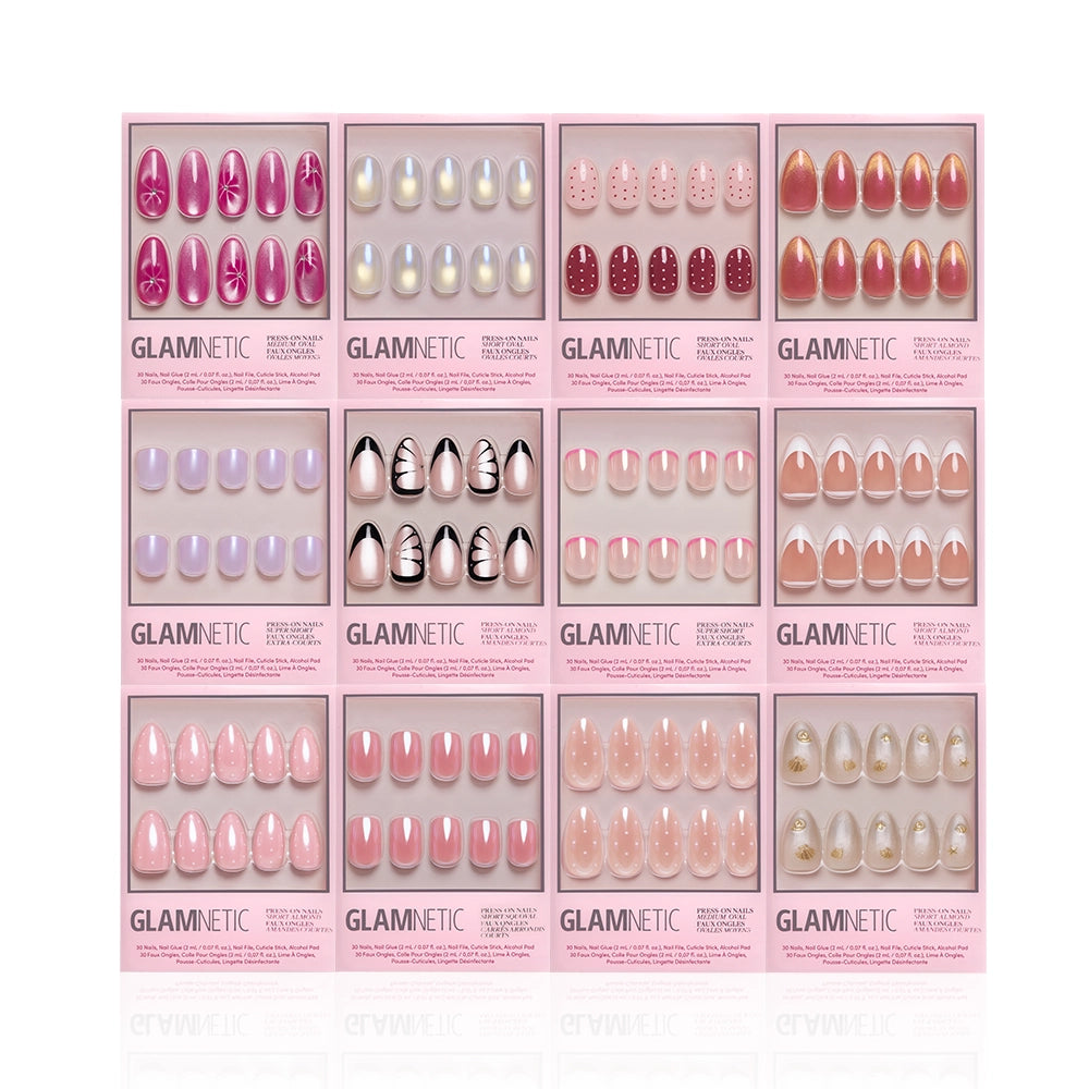 Glamnetic’s The Spring Edit Collection features 12 press-on nail sets in pink packaging with pink, white, lavender, and nude styles. Enjoy luminous nails adorned with polka dots, French tips, floral accents, and shimmer designs. - Product image