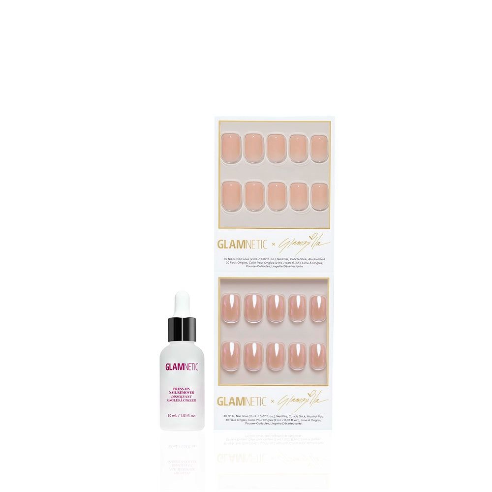 IN THE NUDE by glamnetic features short squoval nude press-on nails in two trays, with a small dropper bottle of Glamnetic nail glue displayed to the left of the packaging. - Product image