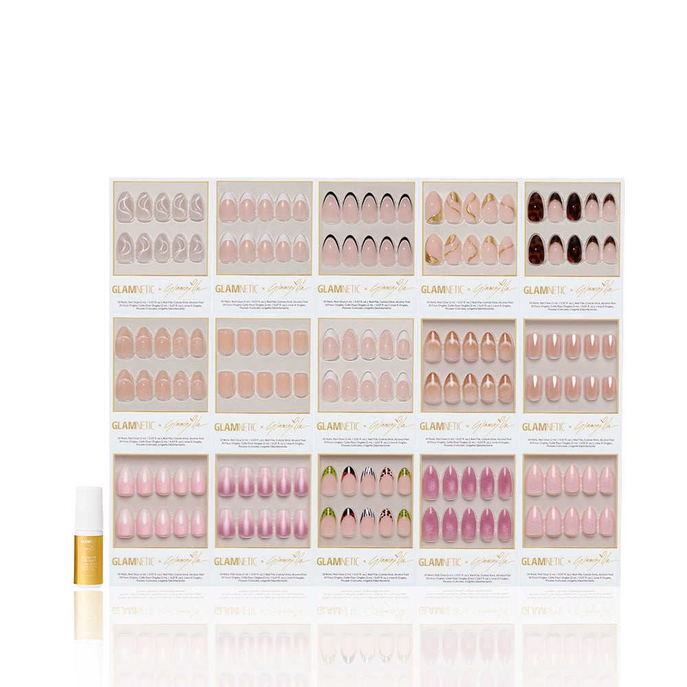 A display of sixteen boxes of glamnetic THE COMPLETE ZILLA press-on nails in assorted shades and designs, with a small gold and white nail glue bottle placed to the left. - Product image