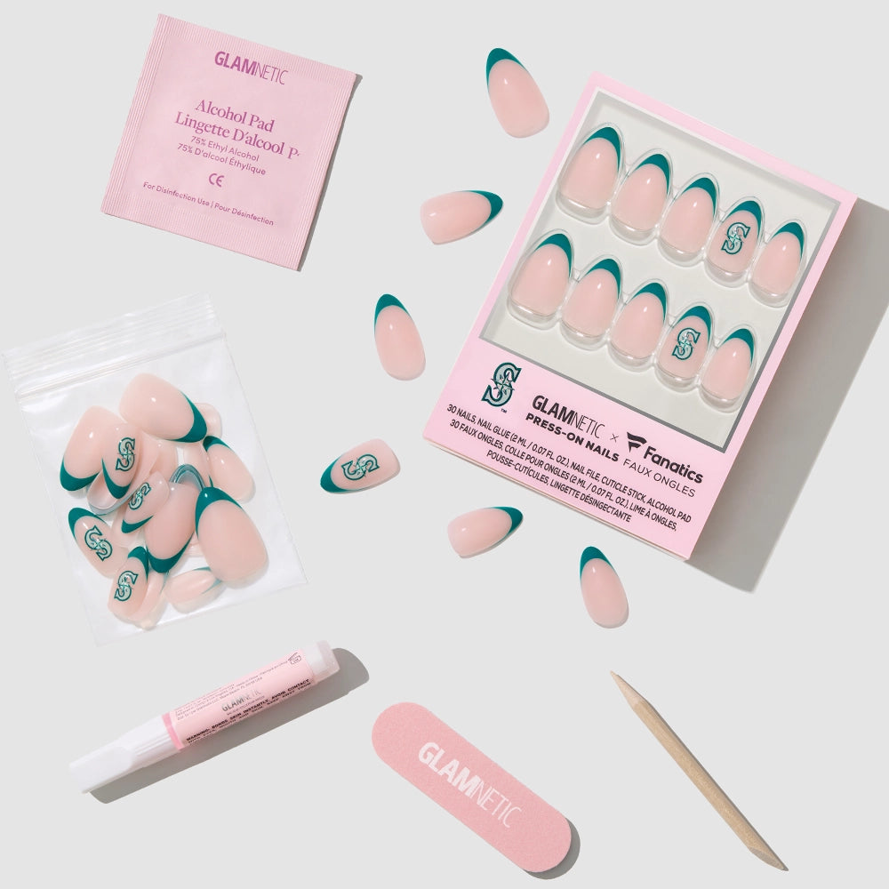 The glamnetic Seattle Mariners Press-On Nail Set features pink almond nails with teal French tips and an S logo. Includes a nail file, alcohol pad, glue, cuticle stick, extra nails, all on a light gray background. - Product image