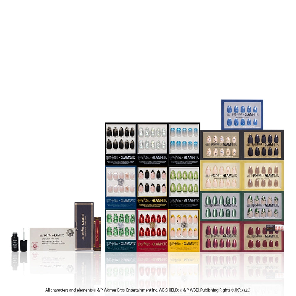 The glamnetic Harry Potter™ x Glamnetic Master Vault showcases house-themed nails and accessories, colorful bottles, and a wand-shaped box neatly arranged like a collector’s vault on a white background.