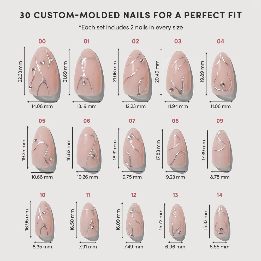A chart displays 15 glamnetic Astro custom-molded short almond press-on nails in various sizes, each numbered and labeled with dimensions. The set features a nude-pink base, silver lines, and rhinestone accents. - Product image