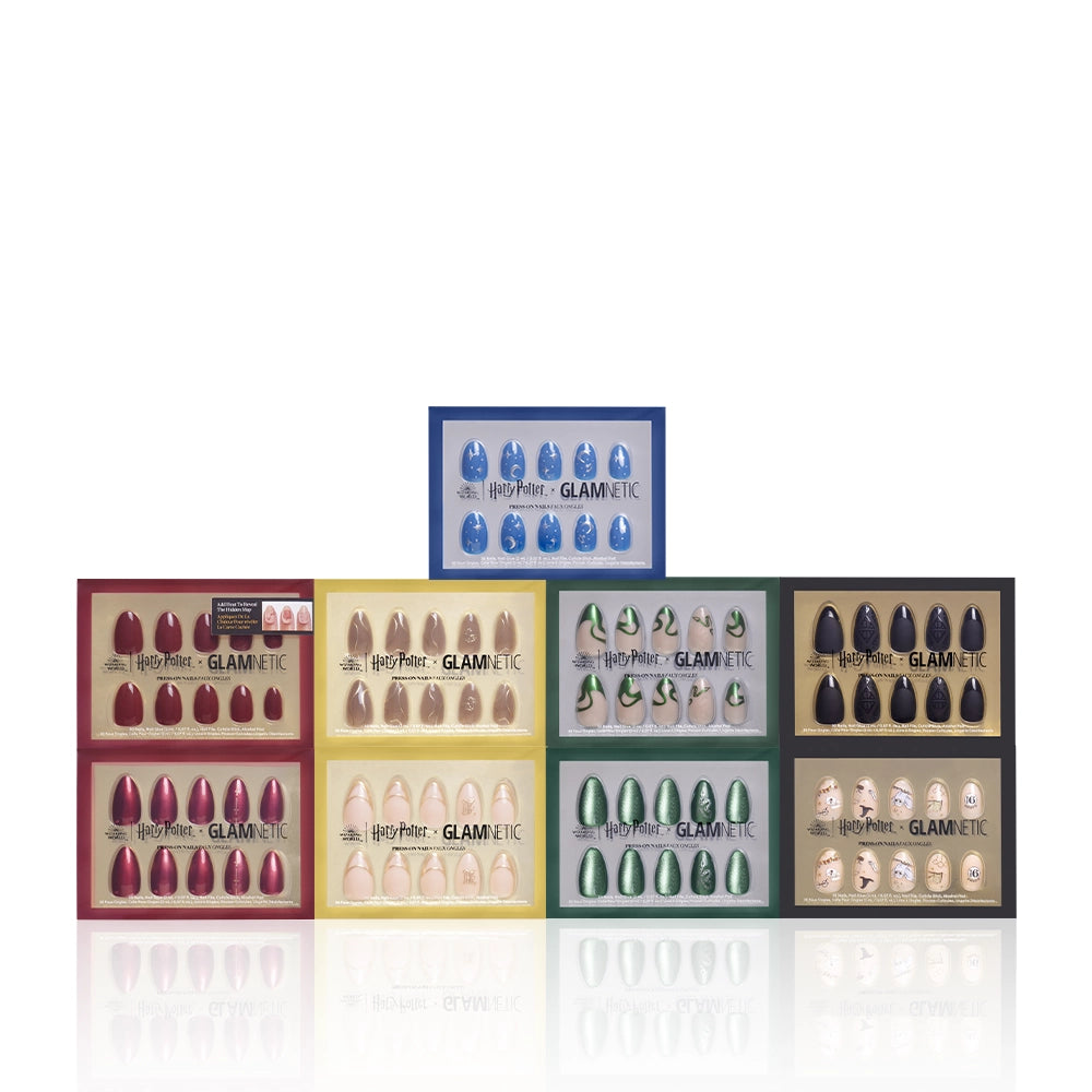 Nine sets of glamnetic's Hogwarts™ Fan press-on nails are displayed in colorful boxes, each set featuring unique nail art inspired by the Harry Potter series’ houses and symbols, all arranged neatly. - Product image
