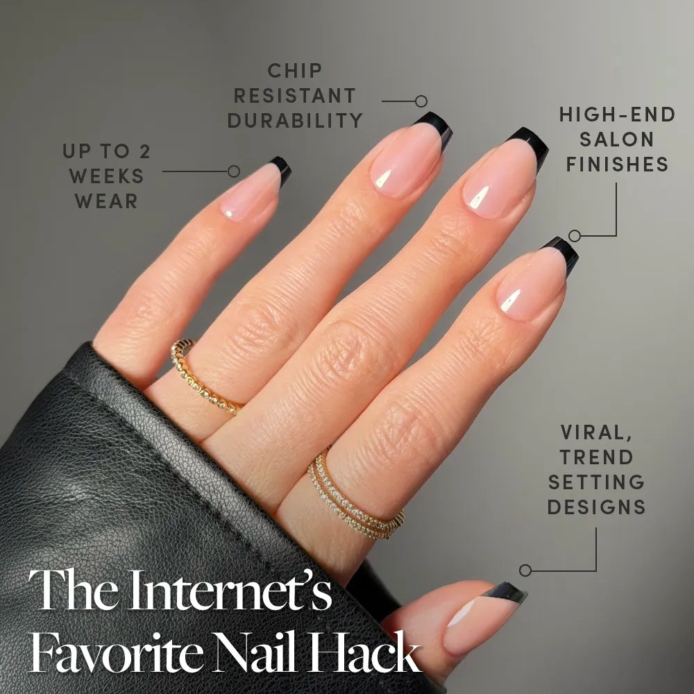 A hand with glamnetic’s Balsamic Glaze black French tip coffin nails, gold rings, and a black sleeve is shown. Text highlights: chip resistant, lasts up to 2 weeks, high-end finish, trendy designs. Text: The Internet’s Favorite Nail Hack. - Product image