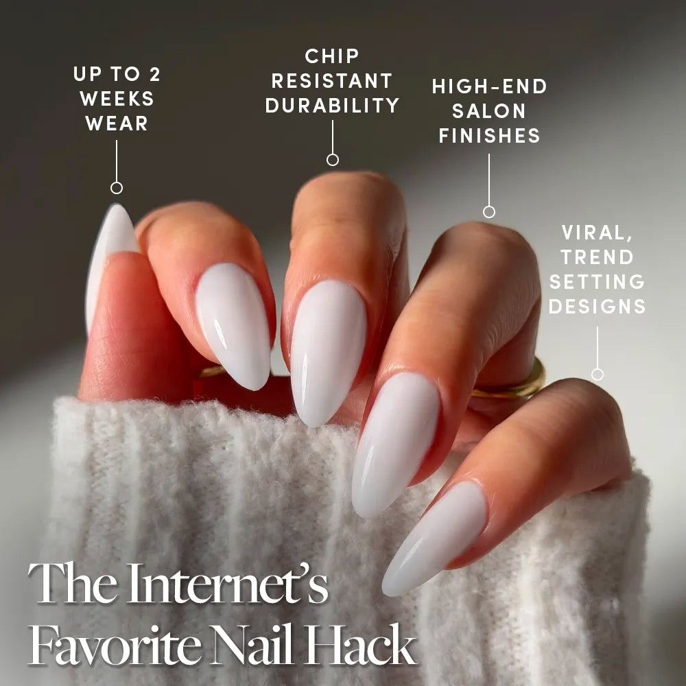 A close-up of a hand with long, almond-shaped, glossy pale glamnetic Clouded nails. These press-ons offer up to 2 weeks wear, chip-resistant durability, and salon-quality, trendsetting designs. - Product image