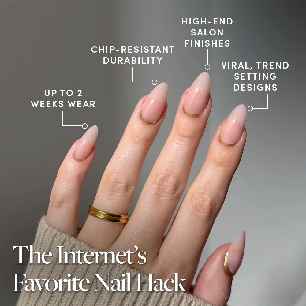 A hand displays glamnetic's Goal Getter: long almond-shaped, nude pink press-on nails with trendy gold French tips. Enjoy up to 2 weeks wear, chip-resistant durability, luxe finishes, and stylish design. - Product image