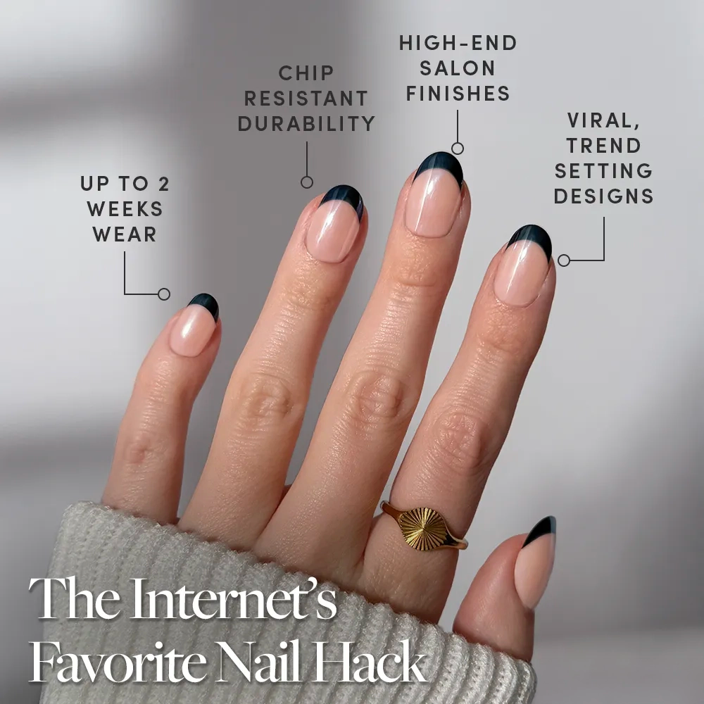 A hand flaunts glamnetic’s Onyx Glaze—black-tipped, almond-shaped French tips with up to 2 weeks wear, chip-resistant durability, salon-quality finish, and viral trend-setting design. - Product image