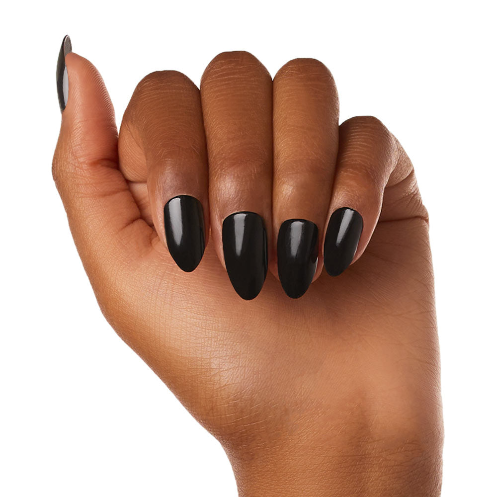 A hand with medium brown skin displays long, almond-shaped, glossy black glamnetic Boba vegan cruelty-free nails against a white background. - Product image