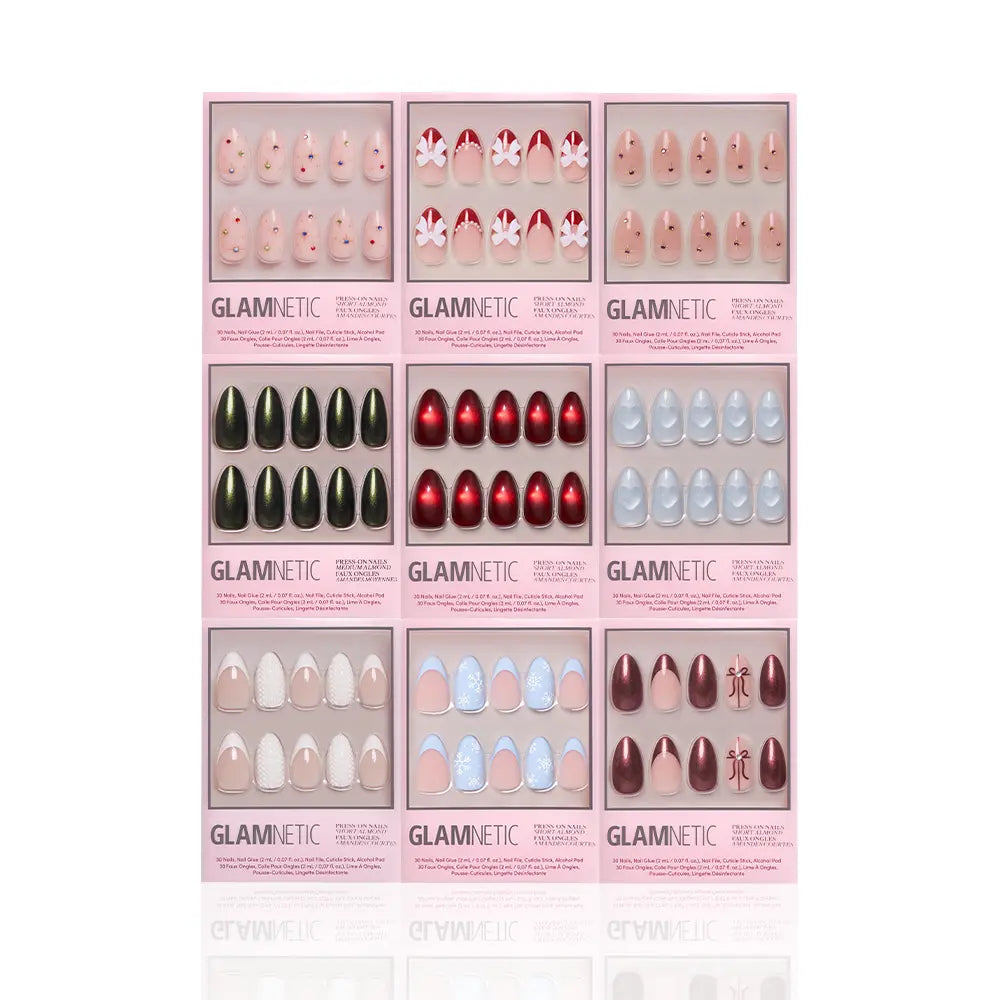 Nine sets of glamnetic Almond Joys press-on nails are arranged in a 3x3 grid, each box featuring almond-shaped nails in various colors and designs, such as glitter French tips, red, black, blue, nude, floral, and holiday patterns. - Product image