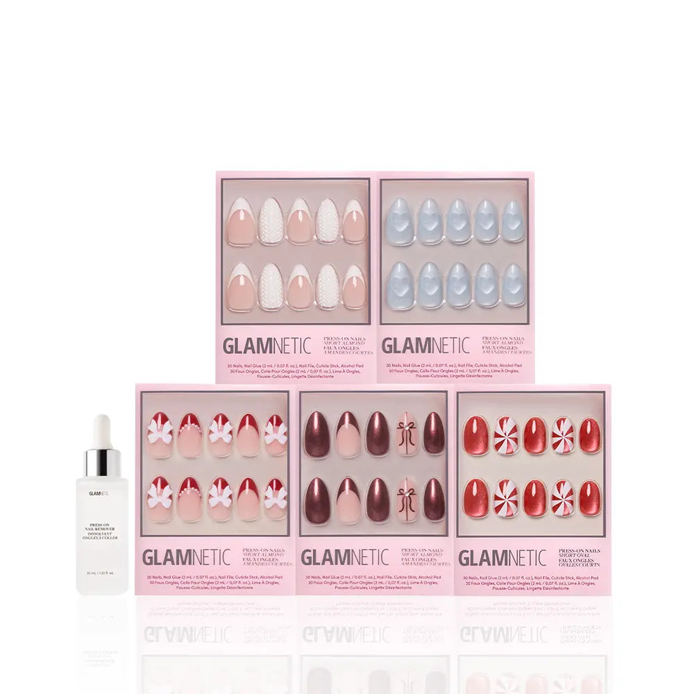 Five boxes of glamnetic Ann's Festive Five press-on nails in assorted designs are displayed in two rows, with a nail glue bottle in front—ideal for party-ready manicures—on a white background. - Product image