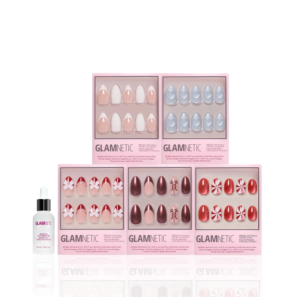 Five boxes of glamnetic Ann's Festive Five press-on nails in assorted designs are displayed in two rows, with a nail glue bottle in front—ideal for party-ready manicures—on a white background. - Product image