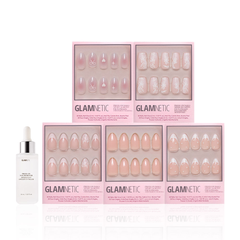 Five boxes of glamnetic Anns Sweethearts press-on nails in soft pink and white French tips, short almond style, are arranged in two rows with a white bottle of glamnetic cuticle oil and dropper on the left. - Product image