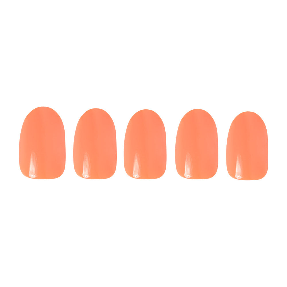 Five glossy peach and coral artificial nails from the glamnetic Apricot collection are arranged in a row on a white background, highlighting this vibrant nail set. - Product image