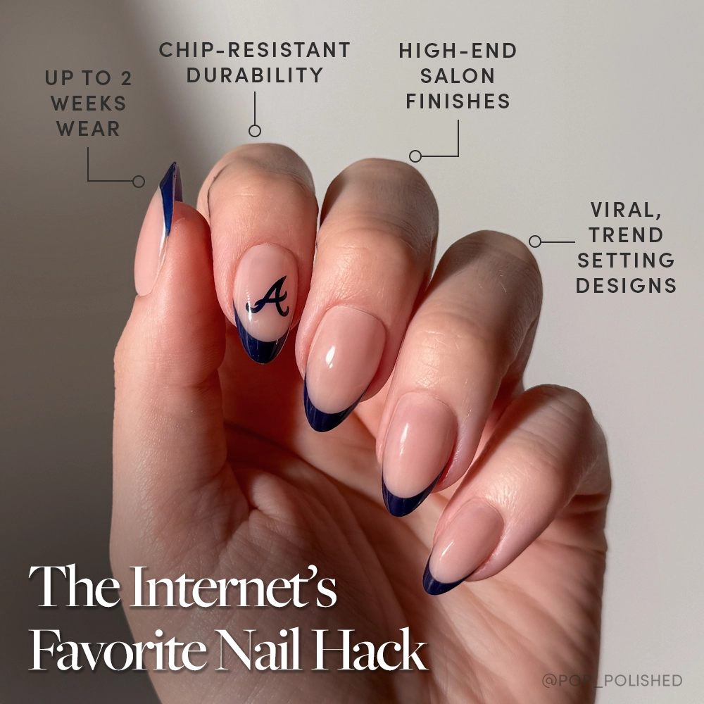 The glamnetic Atlanta Braves Press-On Nail Set features long, almond-shaped nails with navy blue French tips and an A design. Enjoy trendy MLB-inspired style, salon-quality finish, chip-resistant polish, and up to 2 weeks of wear. - Product image