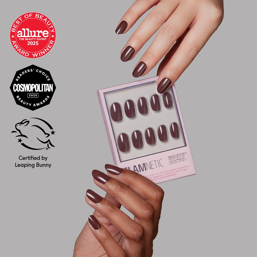 Bark Brown - Hands wearing glossy Bark Brown Glamnetic press-on nails hold the matching box, which features Allure and Cosmopolitan award seals and a Leaping Bunny certification logo.