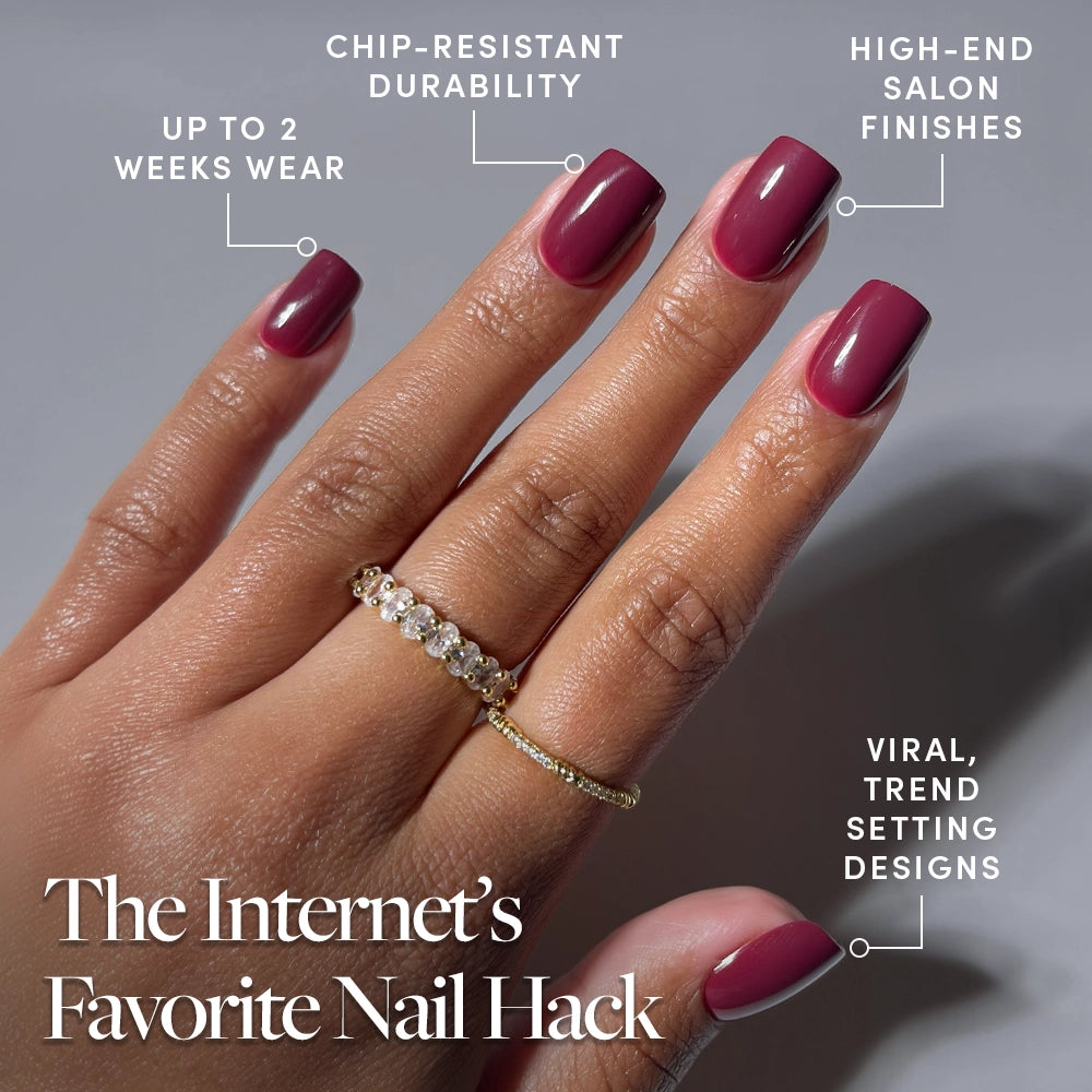 A hand with glossy, maroon glamnetic Berry Crush press-ons shows off two gold rings; text highlights chip-resistant durability, up to two weeks' wear, high-end finishes, and viral designs. The Internet’s Favorite Nail Hack is written below. - Product image