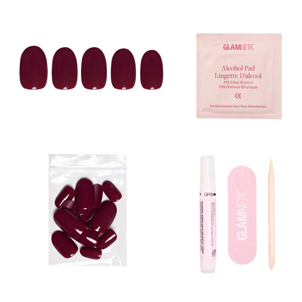 The glamnetic Berry Maroon set features five press-on nails, extra nails, glue, an alcohol pad, a pink nail file, and a wooden cuticle stick—ideal for achieving a Fall Forest-inspired look on a white background. - Product image