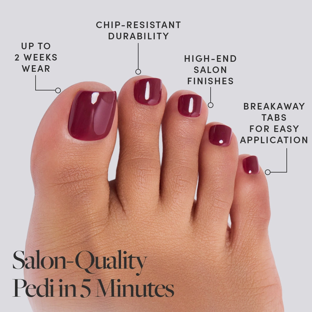 A close-up of glossy Berry Maroon Toenail by glamnetic. Text highlights chip-resistant durability, salon-quality finish, up to 2 weeks’ wear, vegan and cruelty-free formula, plus breakaway tabs for easy application. - Product image