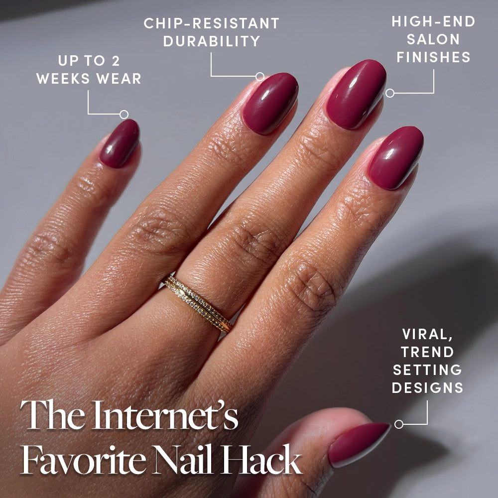 A hand with neatly manicured, glossy maroon Berry Mood press-on nails by glamnetic is shown, highlighting up to 2 weeks wear, chip-resistant durability, salon-quality finish, and on-trend designs. Text: The Internet’s Favorite Nail Hack. - Product image