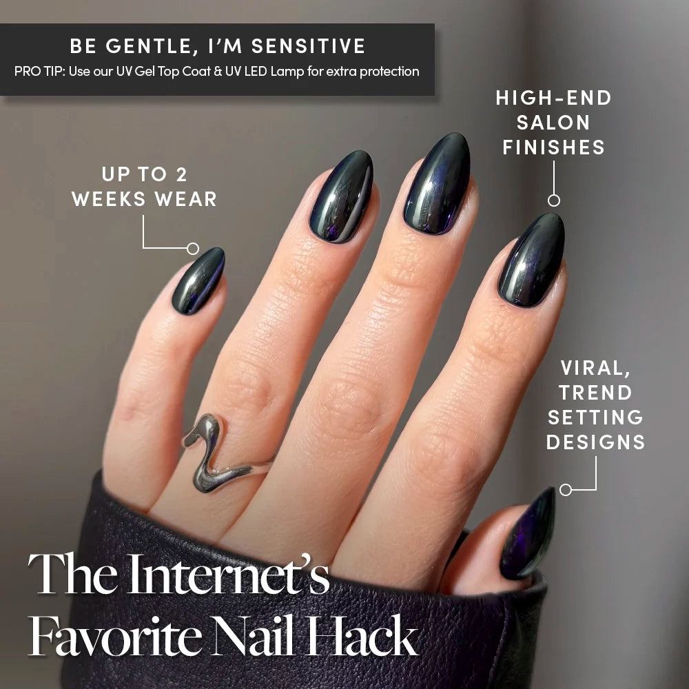 A hand with long, glossy black glamnetic Black Metal nails—crafted from vegan, cruelty-free materials—wears a silver snake-shaped ring. Text highlights the nails’ durability, salon-quality finish, and trendy designs, hailing them as The Internet’s Favorite Nail Hack. - Product image