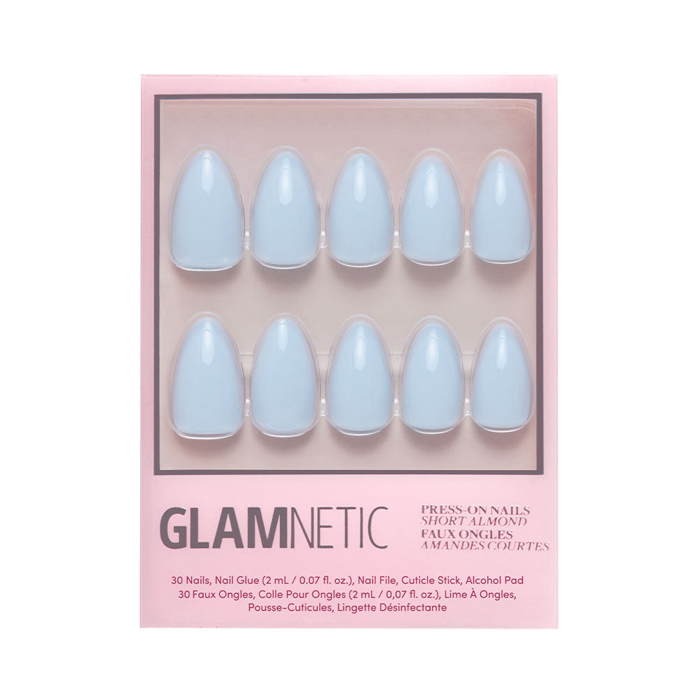 A box of glamnetic Blueberry Milk press-on nails in a short almond shape and glossy light blue finish, arranged in two rows of five and displayed in pink packaging. - Product image