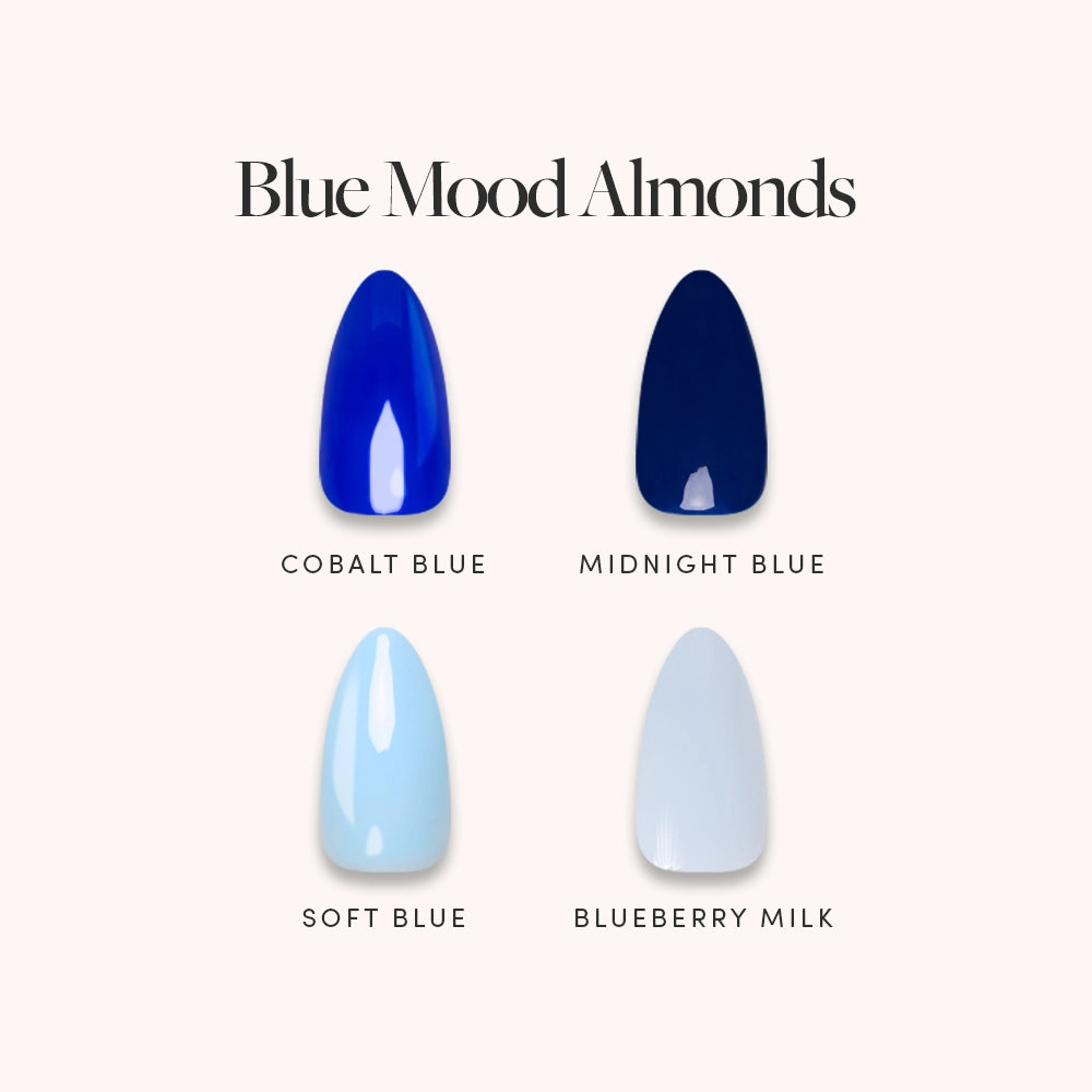 A graphic titled "Blue Mood Almonds" by glamnetic displays four short almond press-on nails in varying blue shades—Cobalt Blue, Midnight Blue, Soft Blue, and Blueberry Milk—arranged in a grid with labels, all set against a light pink background. - Product image