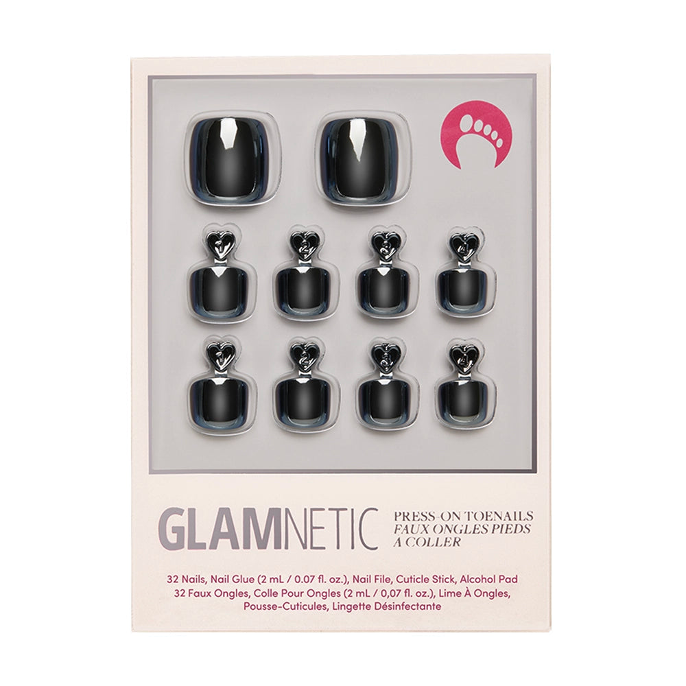 A box of glamnetic Boba Toenail vegan press-on nails is shown, featuring 10 glossy black toenails in assorted sizes, nail glue, and accessories. The packaging displays the glamnetic brand name and product details.