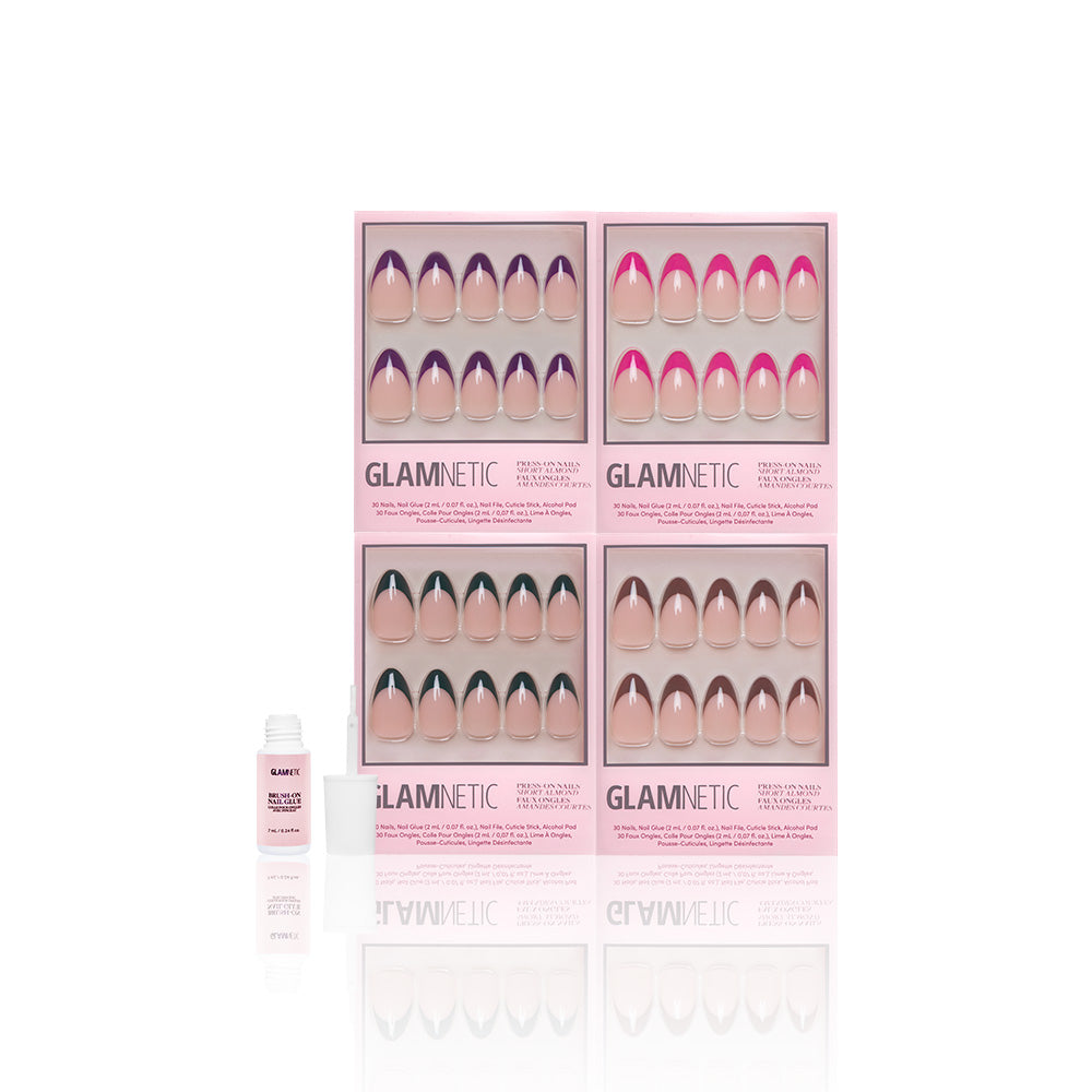 Four boxes of glamnetic Bonbon Babe press-on nails in assorted colors and styles, including French Tip and Almond, are arranged on a white background. A small open bottle of vegan and cruelty-free nail glue is on the left. - Product image